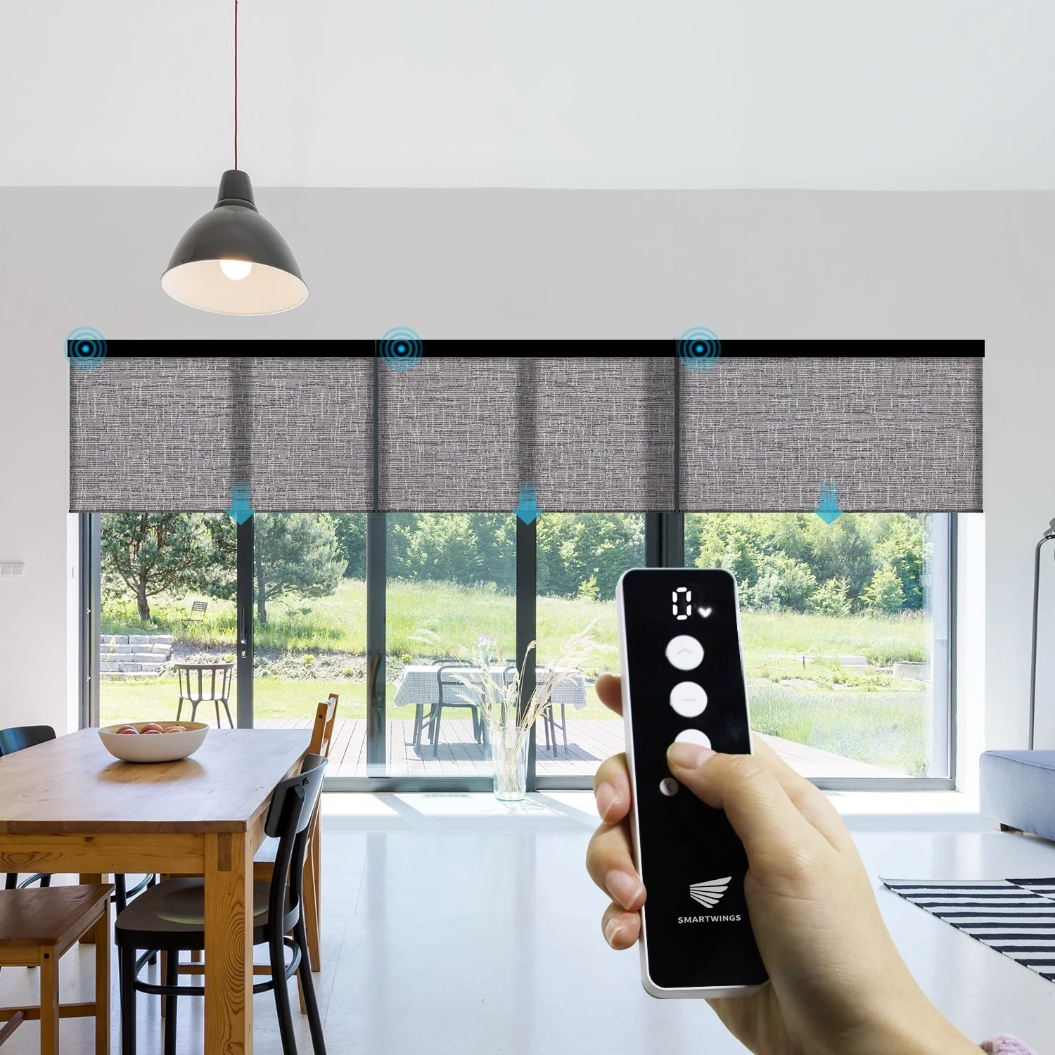 Remote control for motorized roller shades on a patio door