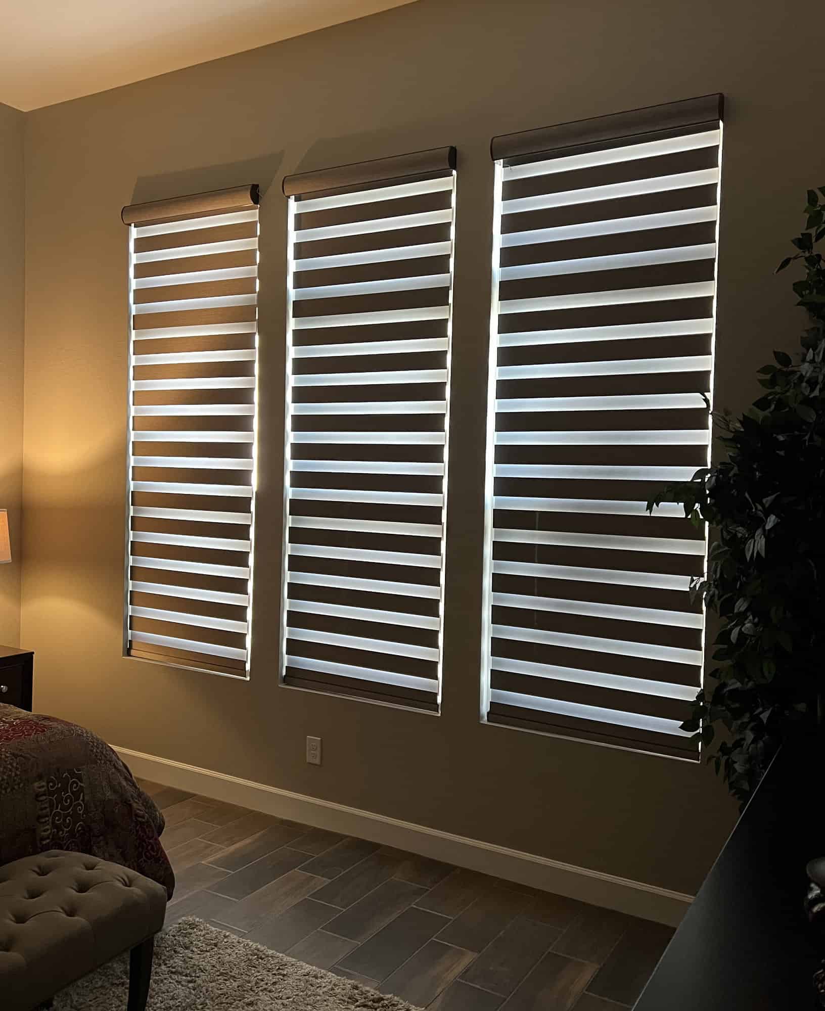 Zebra shades across three bedroom windows